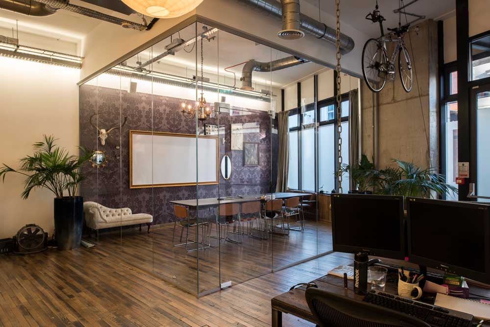 meeting room divided off in office complex by partions from applied workplace